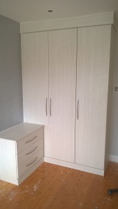 wardrobe with a stable door for bedside cab to come off